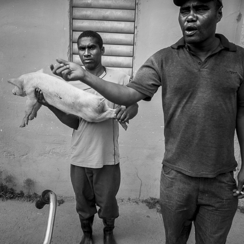 men selling pig